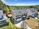 Aerial view of home showing front yard, landscaping, and porch at 421 Gooseberry Dr, Holly Springs, NC 27540