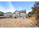 This home's backyard has a patio, playset, and wooden fence at 421 Gooseberry Dr, Holly Springs, NC 27540