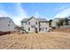 This home's backyard has a patio, playset, and wooden fence at 421 Gooseberry Dr, Holly Springs, NC 27540