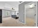 Bedroom featuring a tray ceiling, neutral colors, and an attached walk-in closet at 421 Gooseberry Dr, Holly Springs, NC 27540