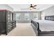 Large bedroom with tray ceiling and neutral carpeting at 421 Gooseberry Dr, Holly Springs, NC 27540