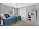 Cozy bedroom with a metal bed frame, neutral walls, closet, desk, and ceiling fan at 421 Gooseberry Dr, Holly Springs, NC 27540