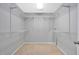 Walk-in closet with white wire shelving at 421 Gooseberry Dr, Holly Springs, NC 27540