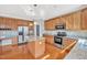 Spacious kitchen boasts stainless appliances, granite countertops, and hardwood floors at 421 Gooseberry Dr, Holly Springs, NC 27540