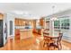 An eat-in kitchen featuring an island, stainless appliances, and hardwood floors at 421 Gooseberry Dr, Holly Springs, NC 27540