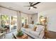Bright living room with neutral sofa, sliding glass doors, and stylish decor at 4240 Camden Woods Ct, Raleigh, NC 27612