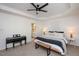 This airy main bedroom offers a piano, bench, ample natural light, and an ensuite bathroom at 4240 Camden Woods Ct, Raleigh, NC 27612