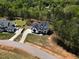 Aerial view of a modern home with pool and manicured landscaping at 45 Hamilton Way, Youngsville, NC 27596