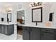 Bathroom featuring double sink vanity, modern lighting and tile flooring at 45 Hamilton Way, Youngsville, NC 27596