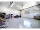 Spacious garage featuring epoxy flooring, ample storage, and natural light at 45 Hamilton Way, Youngsville, NC 27596