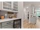 Kitchen with a wine refrigerator, display cabinets, and light gray cabinets at 45 Hamilton Way, Youngsville, NC 27596
