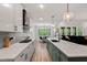 Open kitchen featuring stainless steel appliances, quartz countertops, and a view to the living space at 45 Hamilton Way, Youngsville, NC 27596