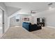 Spacious living room featuring a comfortable sectional, a large television, and a ceiling fan at 45 Hamilton Way, Youngsville, NC 27596
