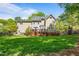 Wide backyard featuring a deck, lawn and privacy fence at 4513 Touchstone Forest Rd, Raleigh, NC 27612