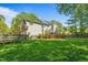 Large backyard with lawn, fence and wood deck at 4513 Touchstone Forest Rd, Raleigh, NC 27612