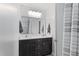Bathroom featuring a double vanity, granite countertops, and a large mirror at 4513 Touchstone Forest Rd, Raleigh, NC 27612