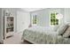 Bright bedroom with two windows, white trim, and neutral carpet at 4513 Touchstone Forest Rd, Raleigh, NC 27612