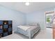 Comfortable bedroom with soft blue walls, plush carpeting, and a cozy bed at 4513 Touchstone Forest Rd, Raleigh, NC 27612
