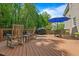 Wood deck with rocking chairs and a table at 4513 Touchstone Forest Rd, Raleigh, NC 27612