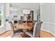 An open kitchen with a round wood dining table at 4513 Touchstone Forest Rd, Raleigh, NC 27612