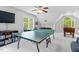 Game room featuring large windows and ping pong table at 4513 Touchstone Forest Rd, Raleigh, NC 27612