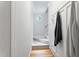 Hallway with hardwood and carpeted stairs and an octagon window at 4513 Touchstone Forest Rd, Raleigh, NC 27612