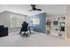 Well-lit home office featuring a ceiling fan, natural light, and a built-in bookshelf at 4513 Touchstone Forest Rd, Raleigh, NC 27612