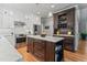 Well-appointed kitchen featuring a large island, stainless steel appliances, and ample cabinet space at 4513 Touchstone Forest Rd, Raleigh, NC 27612