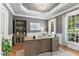 Bright home office with beautiful natural light, custom built-ins, and light wood desk at 4513 Touchstone Forest Rd, Raleigh, NC 27612