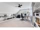 Large office with built-in bookshelves, ceiling fan, and a work space at 4513 Touchstone Forest Rd, Raleigh, NC 27612