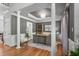 Stylish home office with built-in shelving, tray ceiling, and hardwood floors, ideal for productivity at 4513 Touchstone Forest Rd, Raleigh, NC 27612