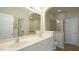 Bathroom featuring a double sink vanity, glass shower, and a large mirror at 4517 Pale Moss Dr, Raleigh, NC 27606
