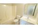 Well-lit bathroom with a shower-tub combo and single sink vanity at 4517 Pale Moss Dr, Raleigh, NC 27606