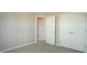 Bedroom with neutral walls, carpet, and closet space at 4517 Pale Moss Dr, Raleigh, NC 27606