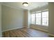 Bright bedroom with LVP flooring, crown moulding and multiple windows at 4517 Pale Moss Dr, Raleigh, NC 27606