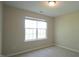 Simple bedroom with natural lighting and neutral walls at 4517 Pale Moss Dr, Raleigh, NC 27606