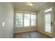 Bright dining room featuring three large windows with natural light and an exterior door at 4517 Pale Moss Dr, Raleigh, NC 27606