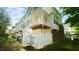 Exterior of townhomes featuring fences, patios, and balconies at 4517 Pale Moss Dr, Raleigh, NC 27606