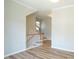 Hallway featuring luxury vinyl plank flooring and white trim at 4517 Pale Moss Dr, Raleigh, NC 27606