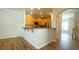 Open-concept kitchen with breakfast bar, stainless steel appliances and hardwood cabinets at 4517 Pale Moss Dr, Raleigh, NC 27606