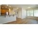 Spacious living room with hardwood floors open to kitchen and dining area at 4517 Pale Moss Dr, Raleigh, NC 27606