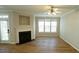 Inviting living room with fireplace, recessed lighting, and a ceiling fan for comfort at 4517 Pale Moss Dr, Raleigh, NC 27606