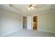 Large main bedroom featuring tray ceilings and an ensuite bathroom at 4517 Pale Moss Dr, Raleigh, NC 27606