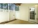 View of the rear patio showcasing the privacy fence and access door at 4517 Pale Moss Dr, Raleigh, NC 27606