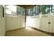 Private, fenced patio with concrete flooring and wooden support beam above at 4517 Pale Moss Dr, Raleigh, NC 27606