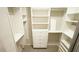 Bright walk-in closet with shelving and drawer units at 4517 Pale Moss Dr, Raleigh, NC 27606