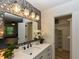 Modern bathroom featuring a decorative mirror, updated vanity and custom wallpaper with a closet at 505 Gooseneck Dr # B1, Cary, NC 27513