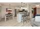 Eat-in kitchen area with bar seating, stainless appliances, and easy access to the front entryway at 505 Gooseneck Dr # B1, Cary, NC 27513