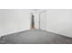 Clean bedroom featuring plush gray carpet and a double closet at 508 Solar Dr, Raleigh, NC 27610