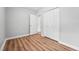 This bedroom features great closet space, hardwood floors, and neutral paint at 508 Solar Dr, Raleigh, NC 27610